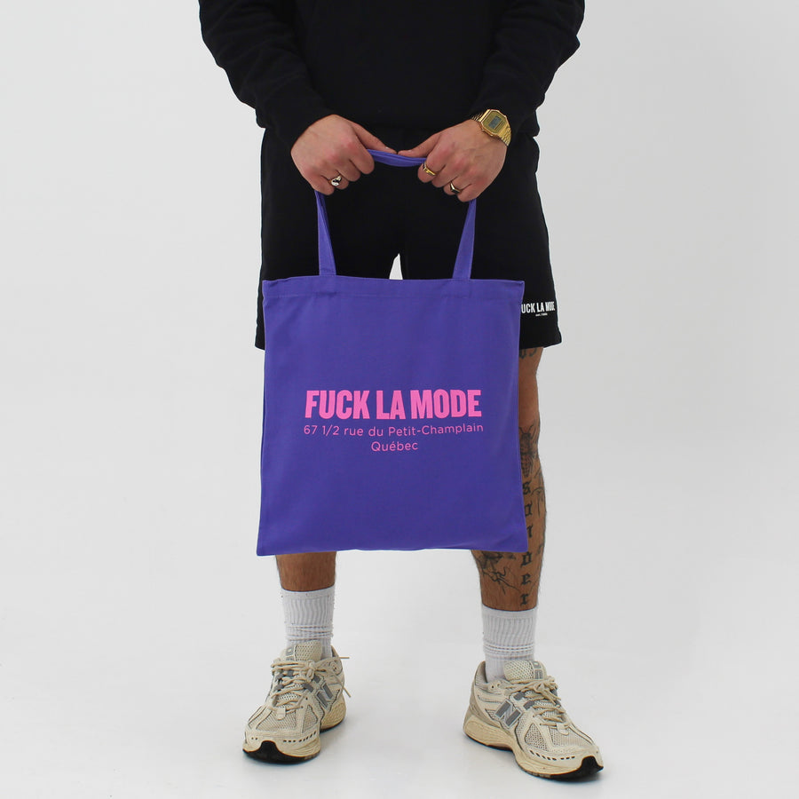 Purple Address tote bag with the “fuck la mode” logo and address in pink — streetwear clothing from Québec City.
