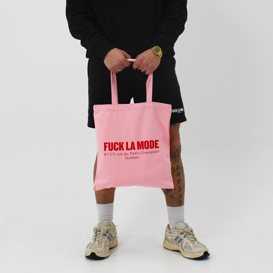 Pink Address tote bag with the “fuck la mode” logo and address in red — streetwear clothing from Québec City.