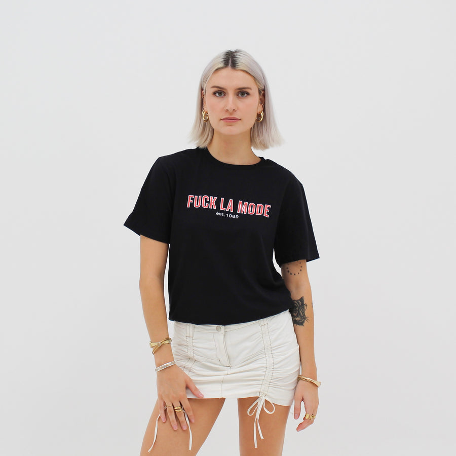 Black retro t-shirt with the red “fuck la mode” logo — streetwear clothing from Québec City.
