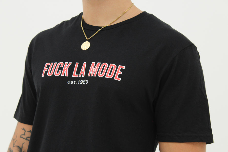 Black retro t-shirt with the red “fuck la mode” logo — streetwear clothing from Québec City.