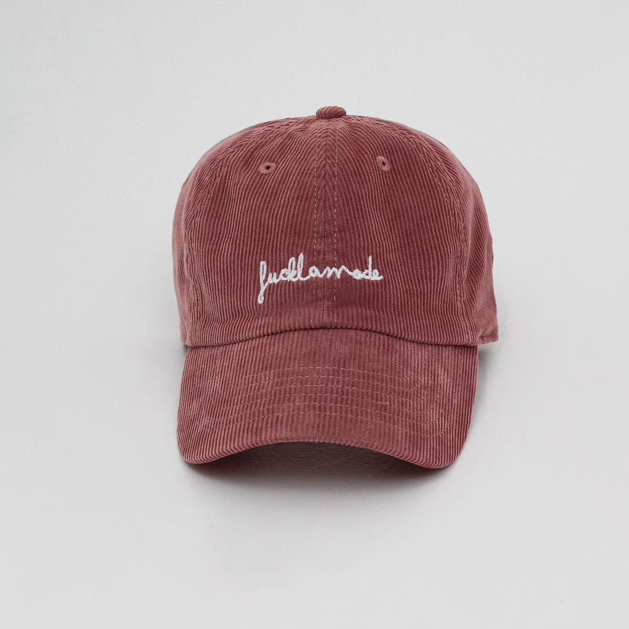 Smoke Pink corduroy cap with the hand-written “fuck la mode” logo in white — streetwear clothing from Québec City.