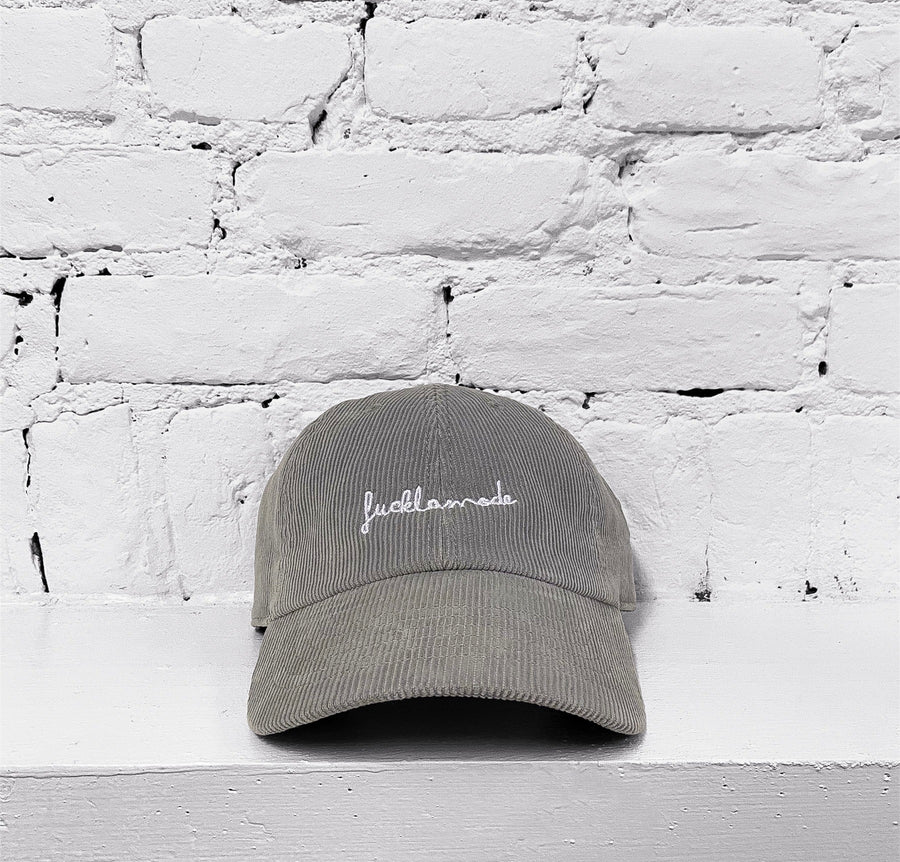 Corduroy cap with the “fuck la mode” script logo — streetwear clothing from Québec City.