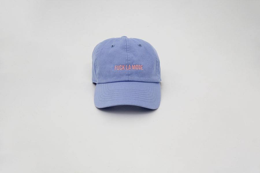 Blue cotton stone-washed cap with the “fuck la mode” logo in pink — streetwear clothing from Québec City.