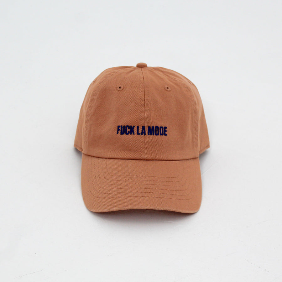 Orange cotton stone-washed cap with the “fuck la mode” logo in navy— streetwear clothing from Québec City.