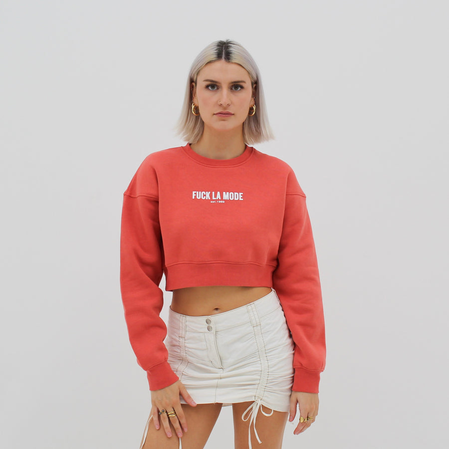 Coral crop sweater with the “fuck la mode” logo in white — streetwear clothing from Québec City.