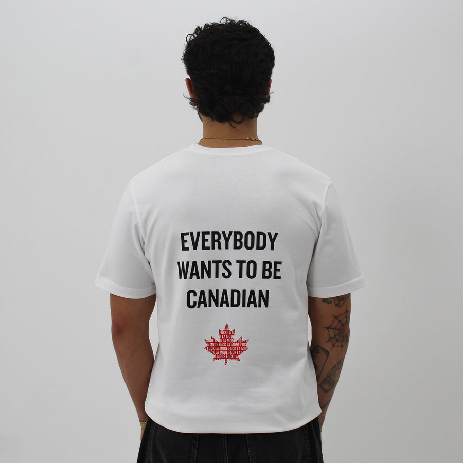 White shirt with “Everybody Wants To Be Canadian” and a red maple leaf “fuck la mode” — streetwear clothing from Québec City.