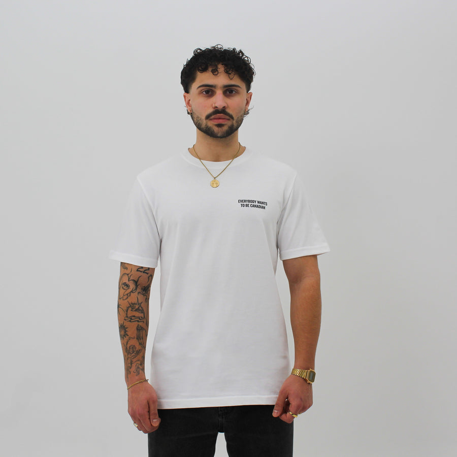White shirt with “Everybody Wants To Be Canadian” and a red maple leaf “fuck la mode” — streetwear clothing from Québec City.