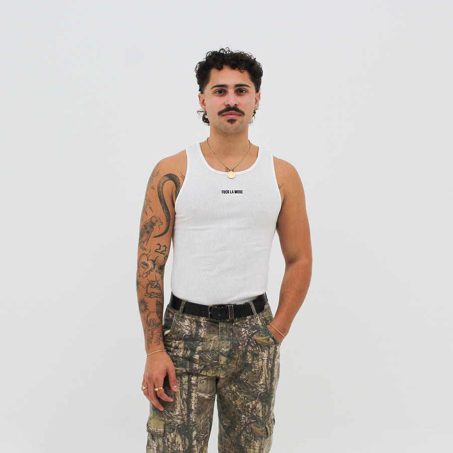 White Wife Beater with the “fuck la mode” logo at the center of the chest — streetwear clothing from Québec City.