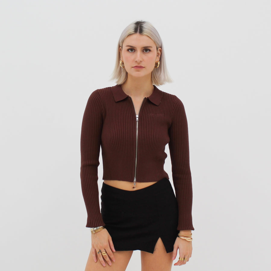 Long sleeve zip polo with a tone-on-tone “fuck la mode” logo — streetwear clothing from Québec City.
