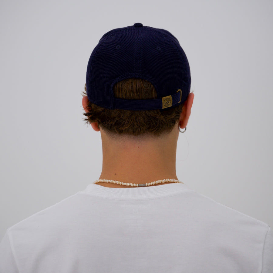 Navy corduroy cap with the “fuck la mode” script logo — streetwear clothing from Québec City.