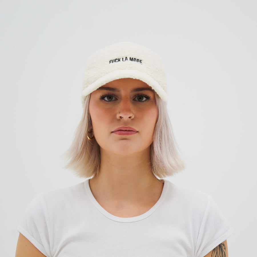 Off-white Sherpa “fuck la mode” cap with the “fuck la mode” logo in green — streetwear clothing from Québec City.