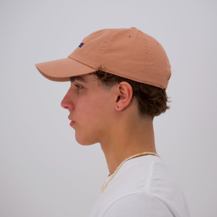 Orange cotton stone-washed cap with the “fuck la mode” logo in navy— streetwear clothing from Québec City.