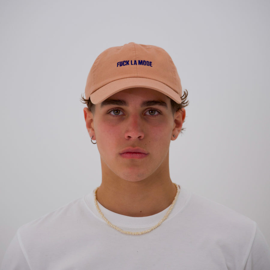 Orange cotton stone-washed cap with the “fuck la mode” logo in navy— streetwear clothing from Québec City.