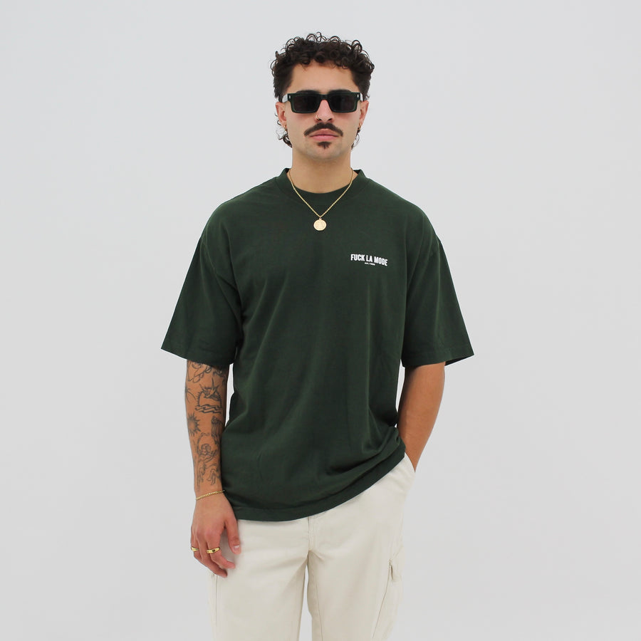 Green oversized classic t-shirt with the “fuck la mode” logo in cream — streetwear clothing from Québec City.
