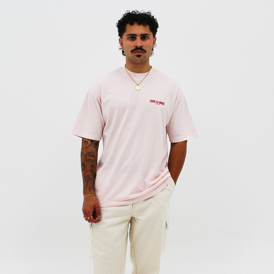 Pink oversized classic t-shirt with the “fuck la mode” logo in red — streetwear clothing from Québec City.