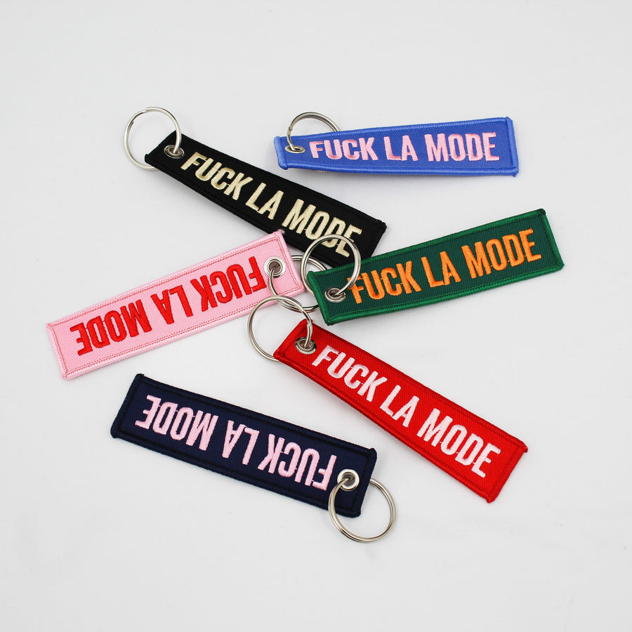 “Fuck la mode” keychain with bright colors — streetwear clothing from Québec City.