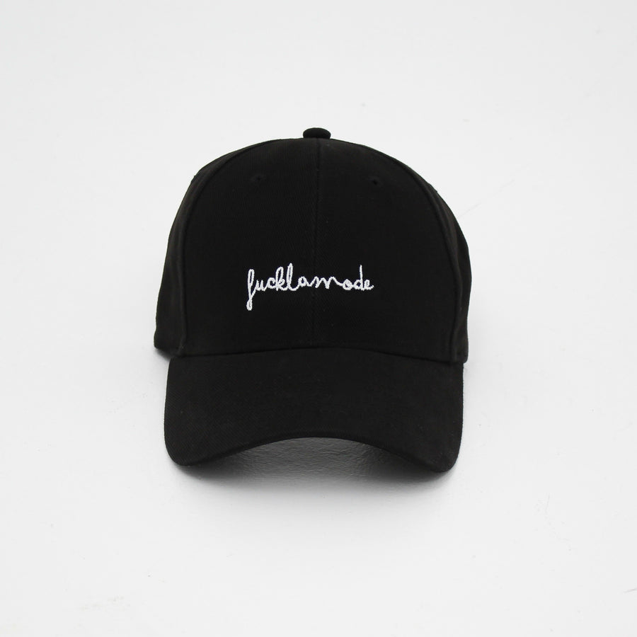 Black premium handwriting cap with the hand-written “fuck la mode” logo in white — streetwear clothing from Québec City.