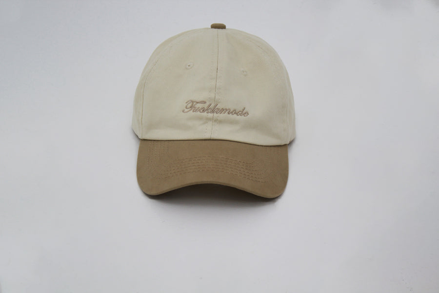 Beige cap with the ““fuck la mode”” script — streetwear clothing from Québec City.