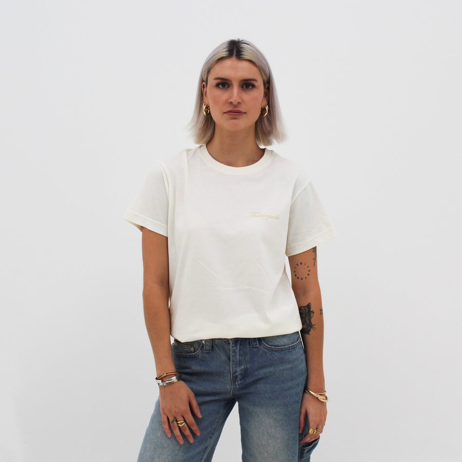 Cream “fuck la mode” t-shirt with the “fuck la mode” script logo — streetwear clothing from Québec City.