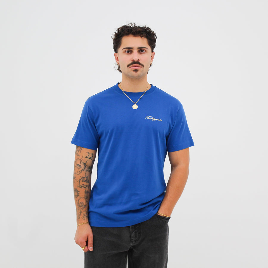 Royal “fuck la mode” t-shirt with the “fuck la mode” script logo — streetwear clothing from Québec City.