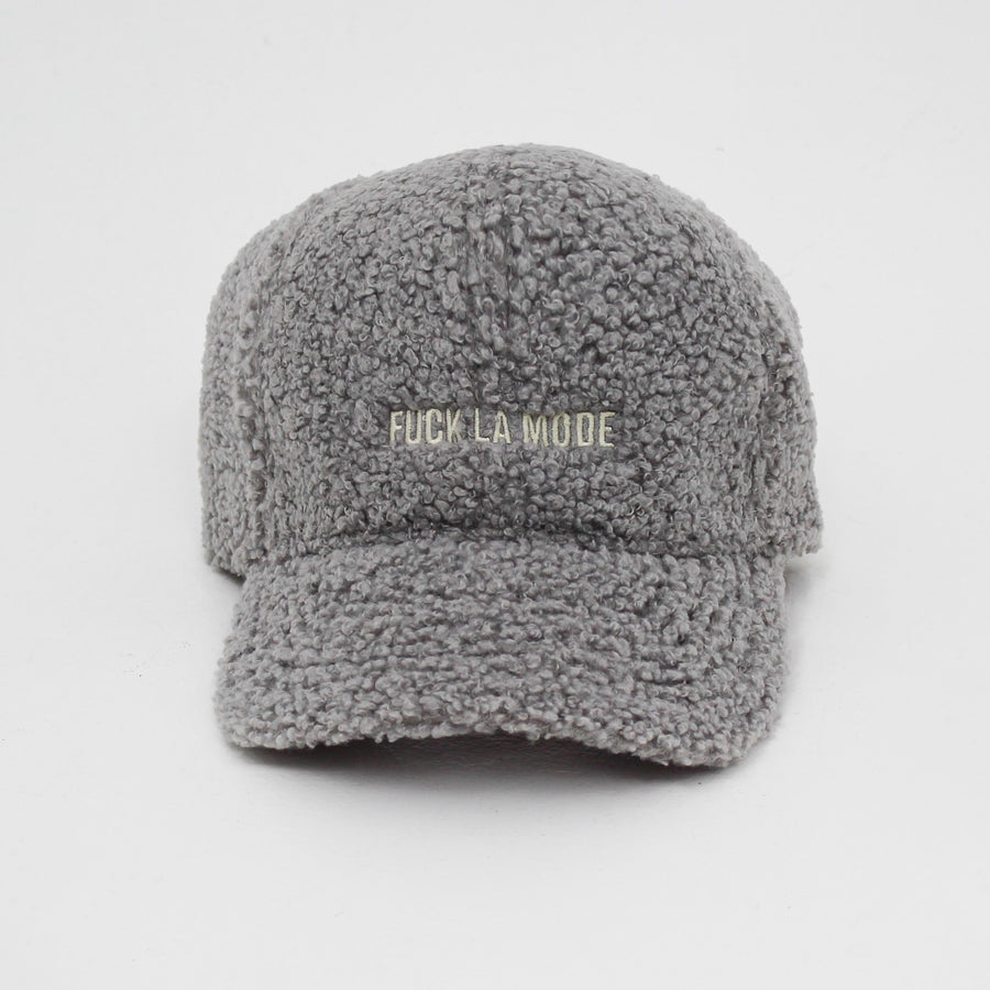 Grey Sherpa “fuck la mode” cap with the “fuck la mode” logo in white — streetwear clothing from Québec City.