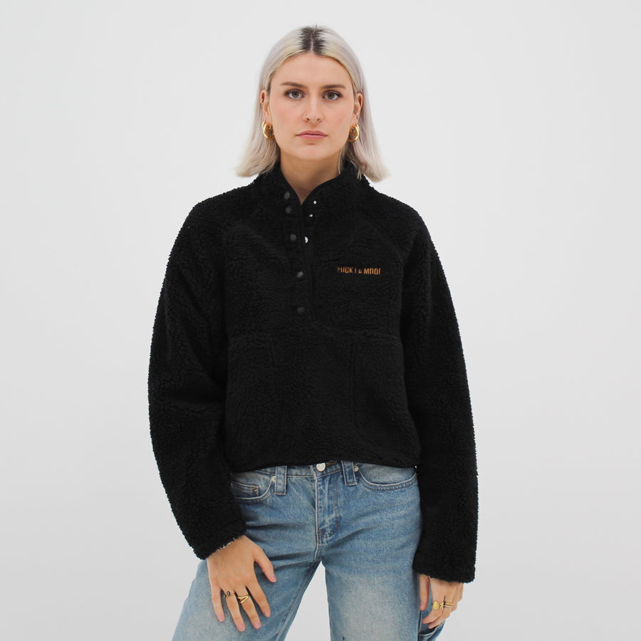Sherpa quarter-zip with the “fuck la mode” logo — streetwear clothing from Québec City.
