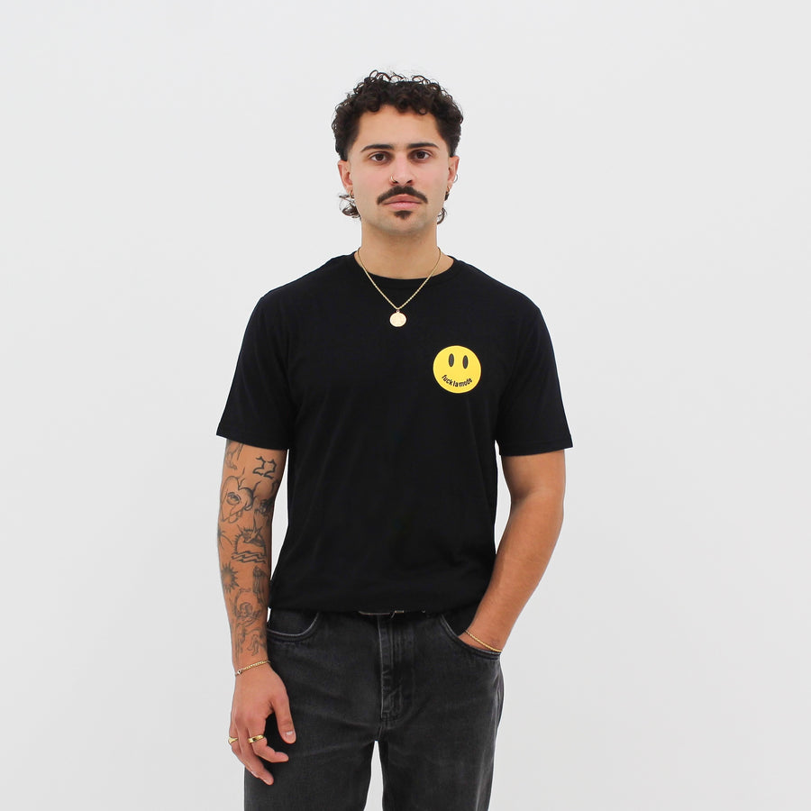 Black “fuck la mode” smiley face t-shirt with a yellow “fuck la mode” smiley face — streetwear clothing from Québec City.