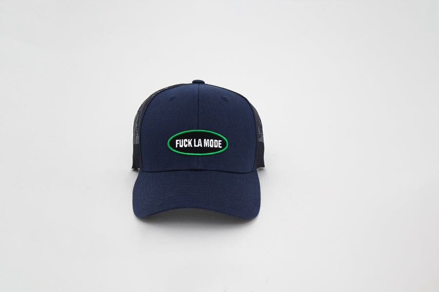 Navy trucker “fuck la mode” cap with a “fuck la mode” logo patch on the front — streetwear clothing from Québec City.