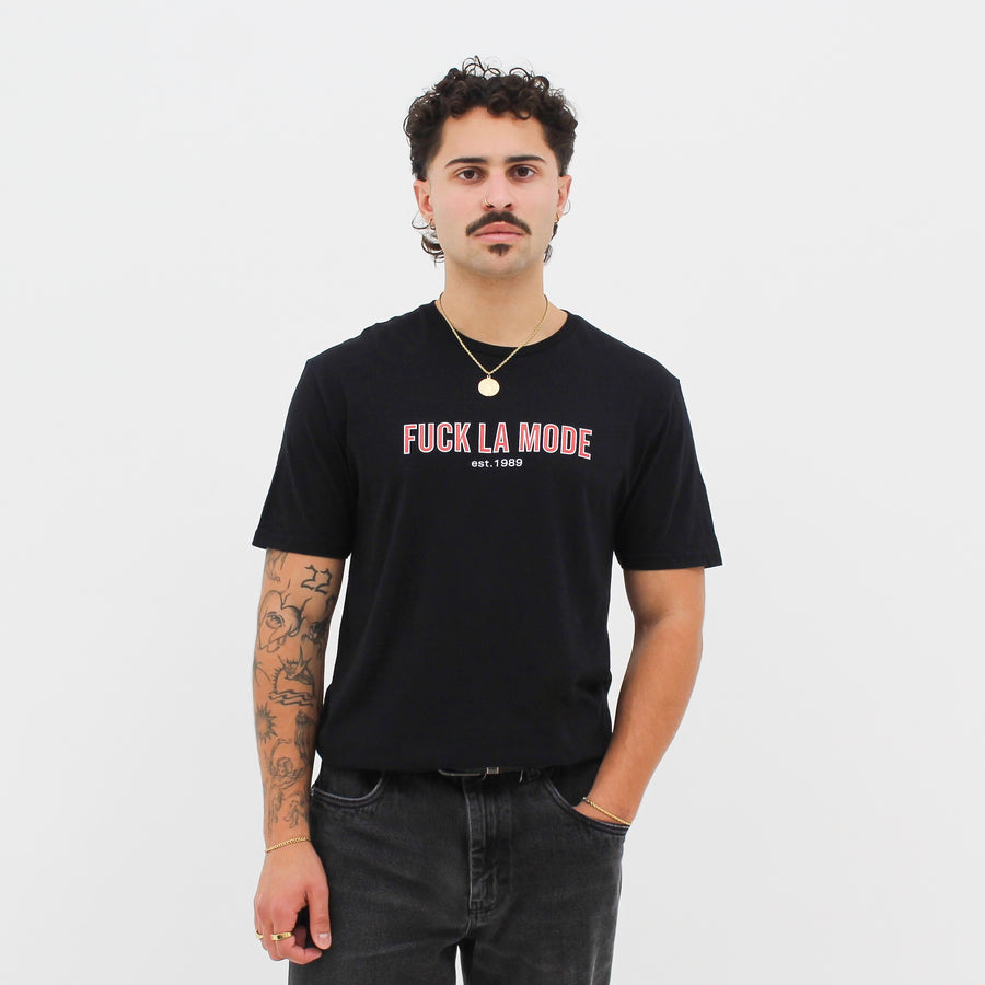 Black retro t-shirt with the red “fuck la mode” logo — streetwear clothing from Québec City.