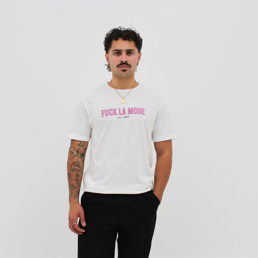 Unisex white retro athletic t-shirt with the retro pink “fuck la mode” logo — streetwear clothing from Québec City.