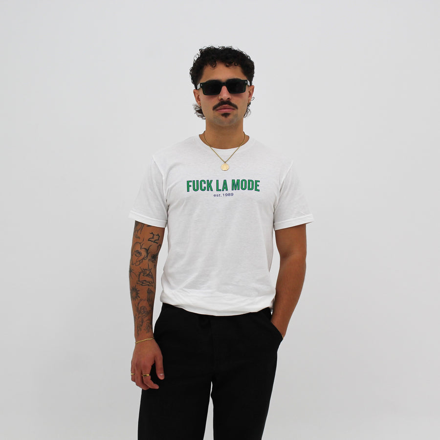 Unisex white retro athletic t-shirt with the retro green “fuck la mode” logo — streetwear clothing from Québec City.