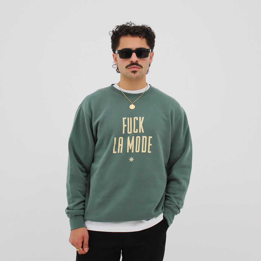Vintage green “fuck la mode” sweater with vintage “fuck la mode” logo in yellow — streetwear clothing from Québec City.