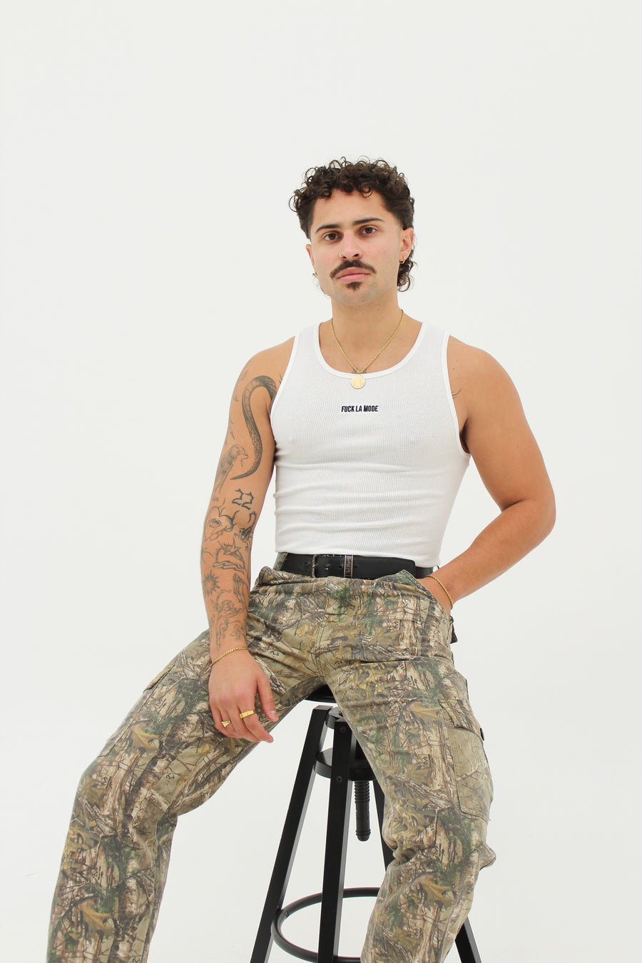 White Wife Beater with the “fuck la mode” logo at the center of the chest — streetwear clothing from Québec City.