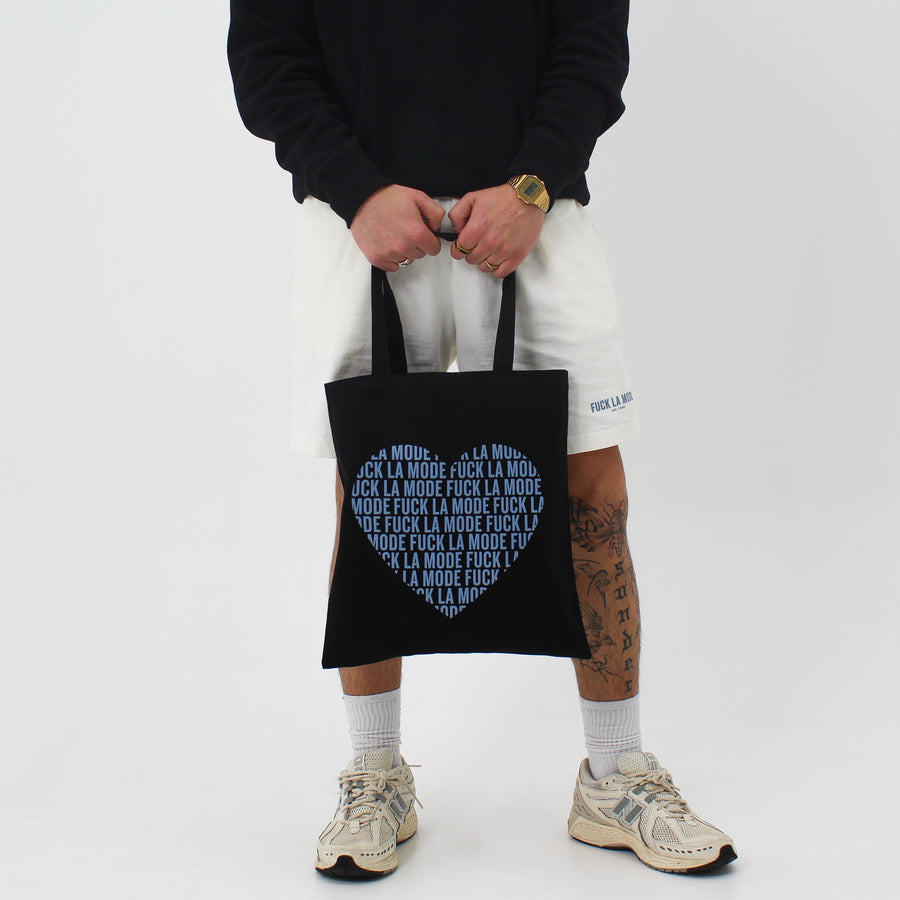 Black FLM tote bag with an “fuck la mode” heart — streetwear clothing from Québec City.