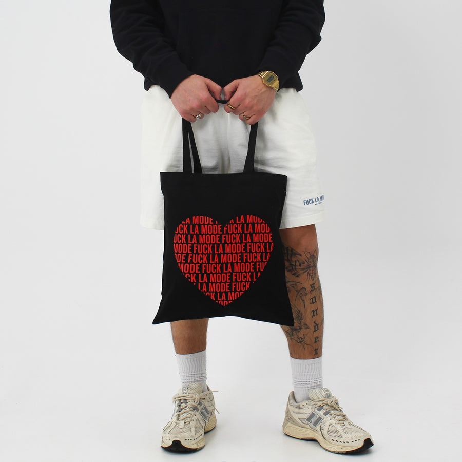 Black FLM tote bag with an “fuck la mode” heart — streetwear clothing from Québec City.