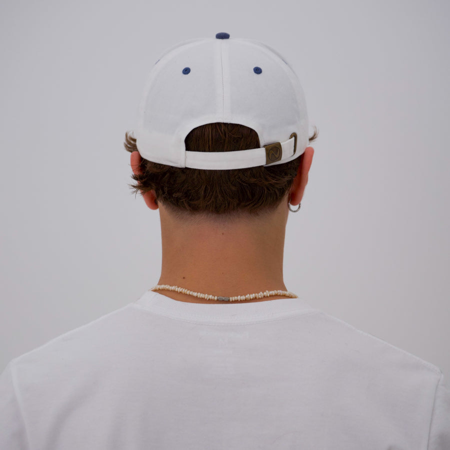 Blue and white “fuck la mode” script cap — streetwear clothing from Québec City.