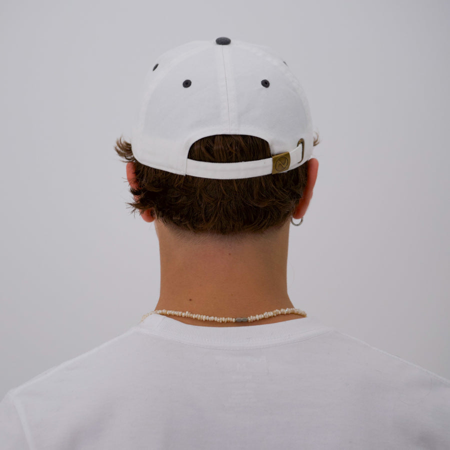 Black and white “fuck la mode” script cap — streetwear clothing from Québec City.