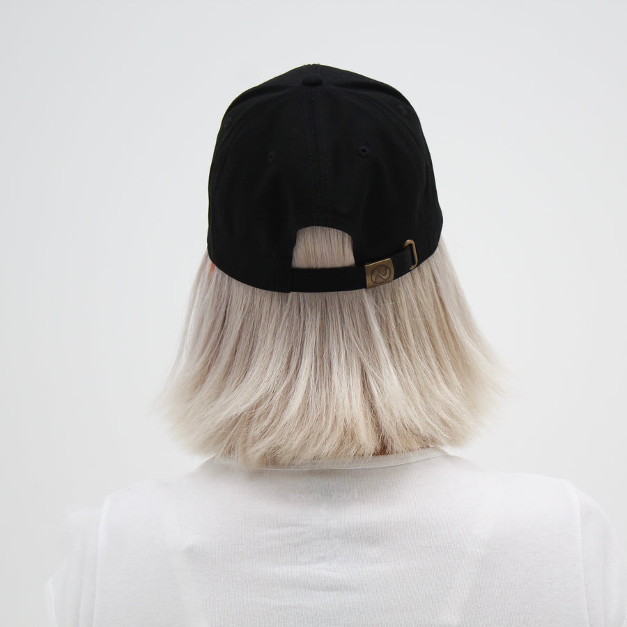 Black trucker hat with a yellow smiley face “fuck la mode” — streetwear clothing from Québec City.