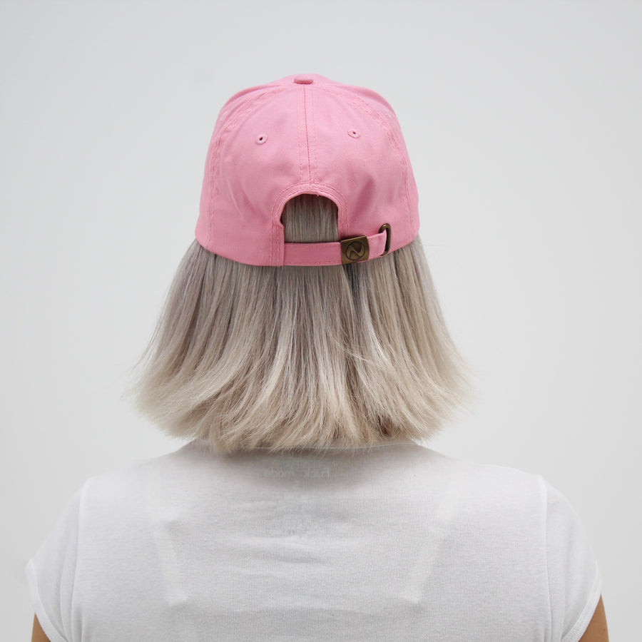 Pink trucker hat with a yellow smiley face “fuck la mode” — streetwear clothing from Québec City.